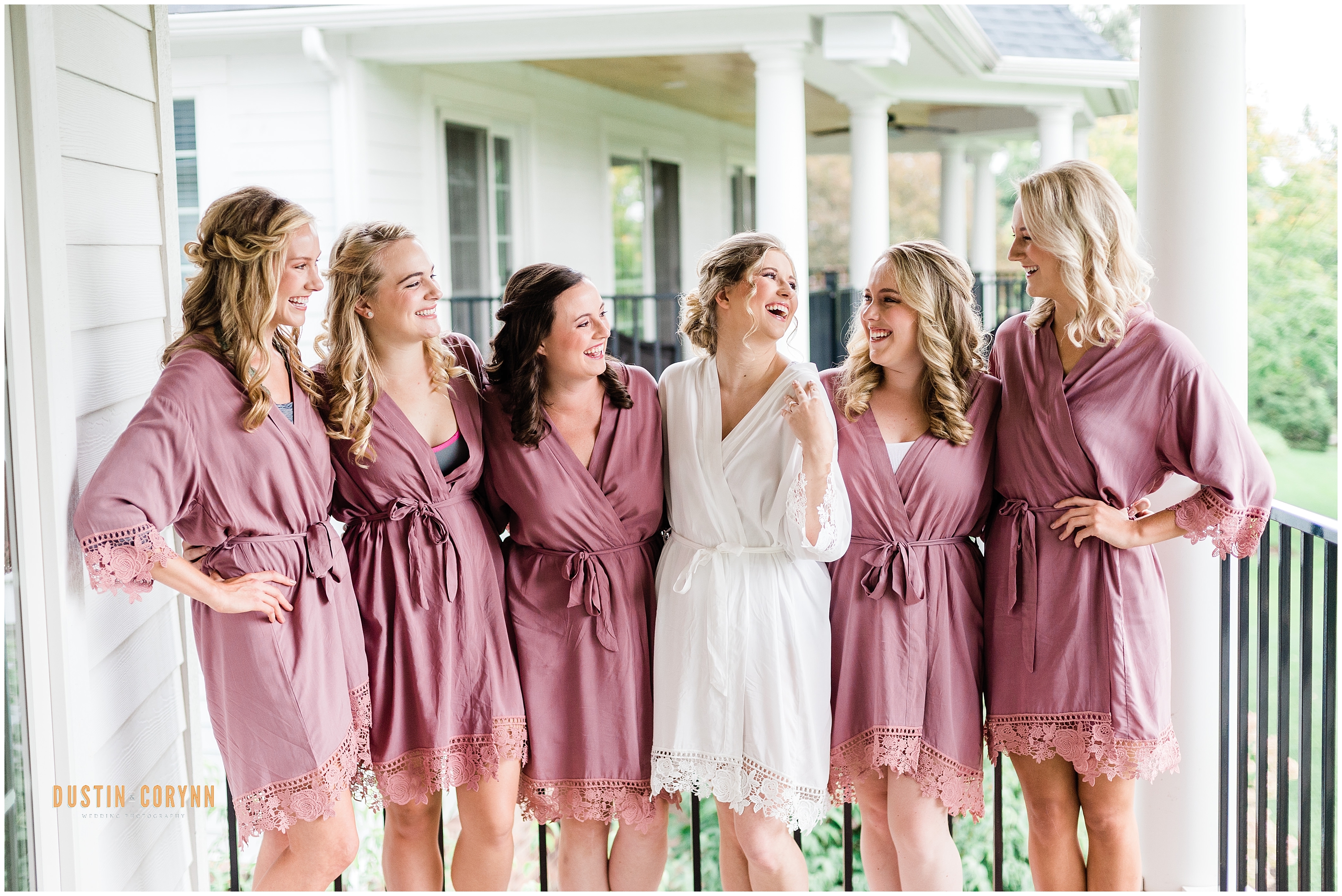 Indiana wedding photographer captures bride wearing matching robes with bridesmaids before Sycamore Hills Golf Club Wedding ceremony