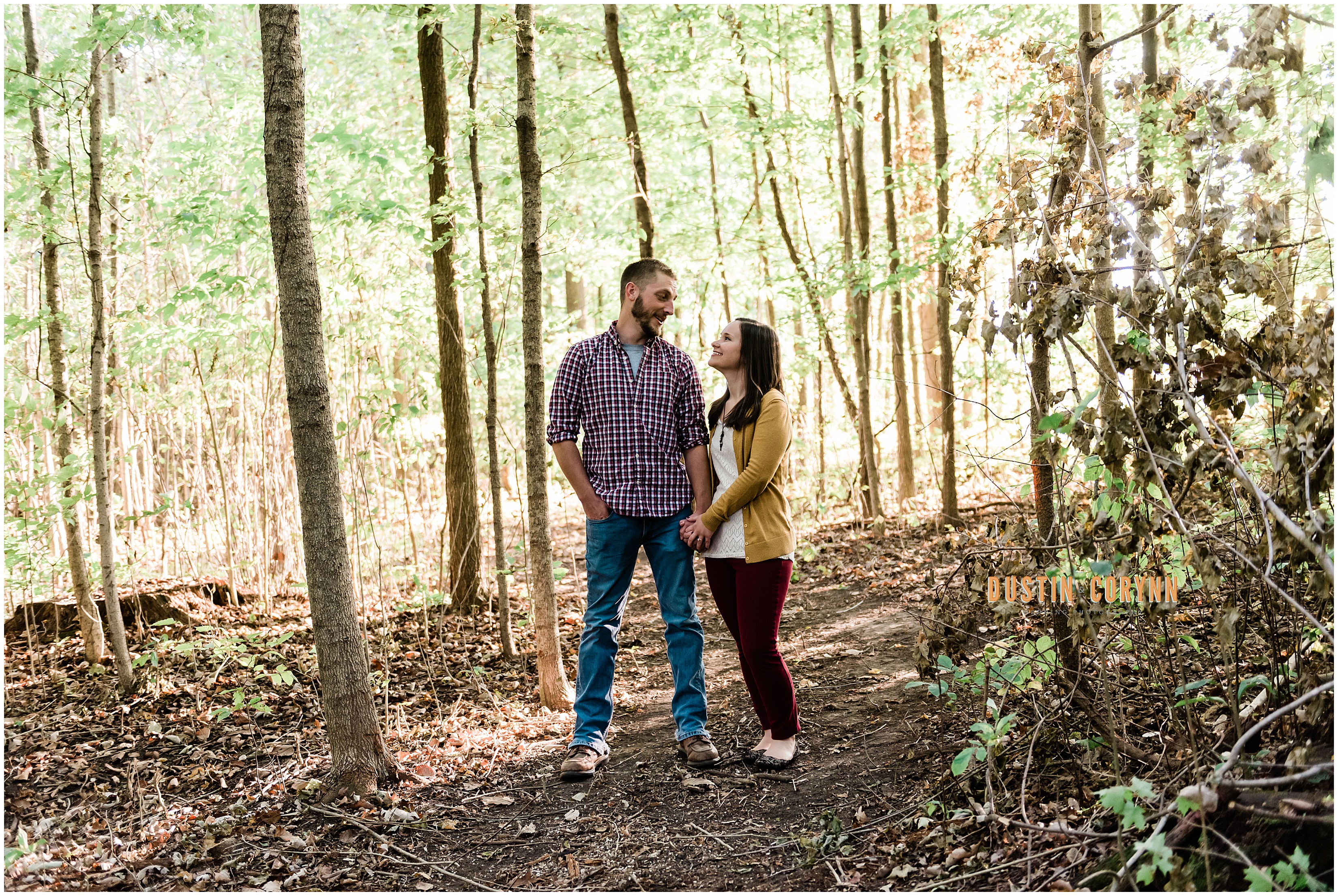 Couple Holding Hands During Home Engagement Session