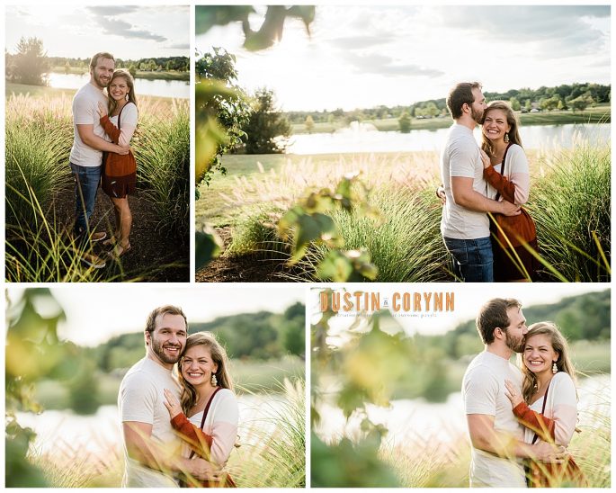 garden engagement photos at sunset with man and woman hugging in a tall grass field 