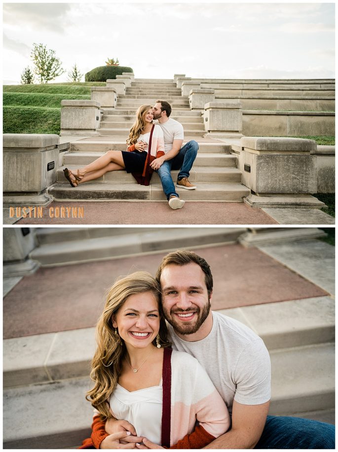 man and woman sitting together and man kissing the womans forehead as she smiles captured by Fort Wayne engagement photographer