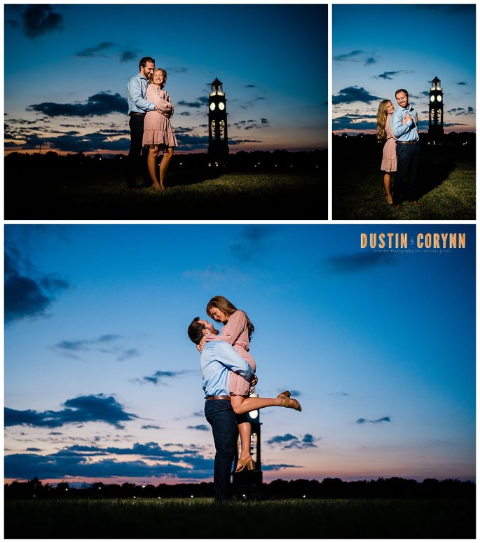 blue hour engagement session with the sun set behind the couple as the man picks up the woman in Coxhill Gardens 