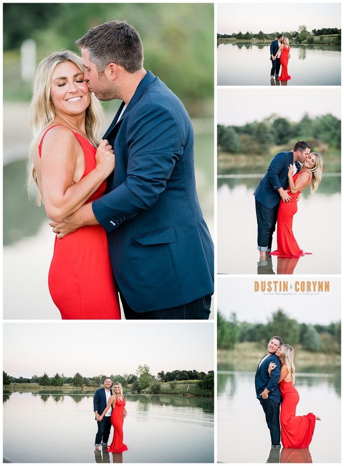 formal engagement photos taken by the best Indiana wedding photographers with the couple standing in the river and kissing each other with the man in his blue suit and the woman in a red dress