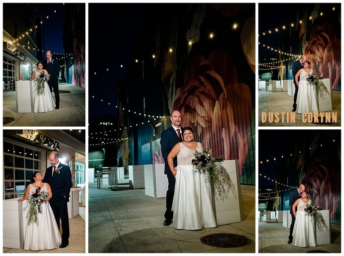 night time bridal portraits in an alley with string lights, bride and groom holding each other