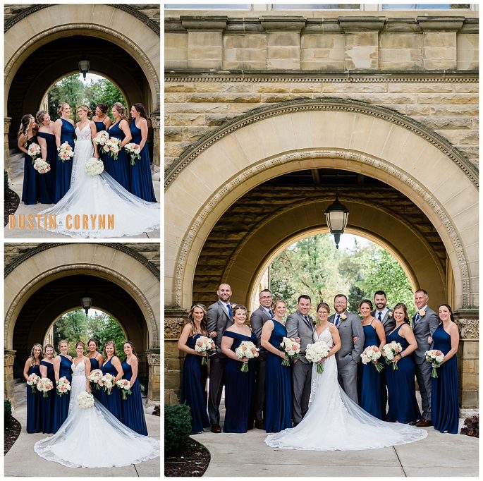 bride with her bridesmaids posing in front of an arch of the church with their white and pink florals