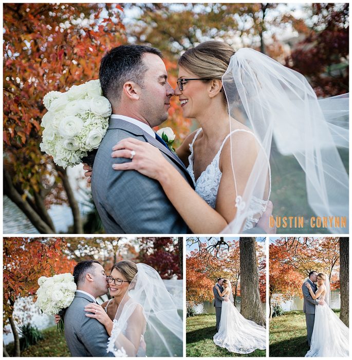 fall wedding photos with a bride and groom holding each other with the brides veil blowing in the wind