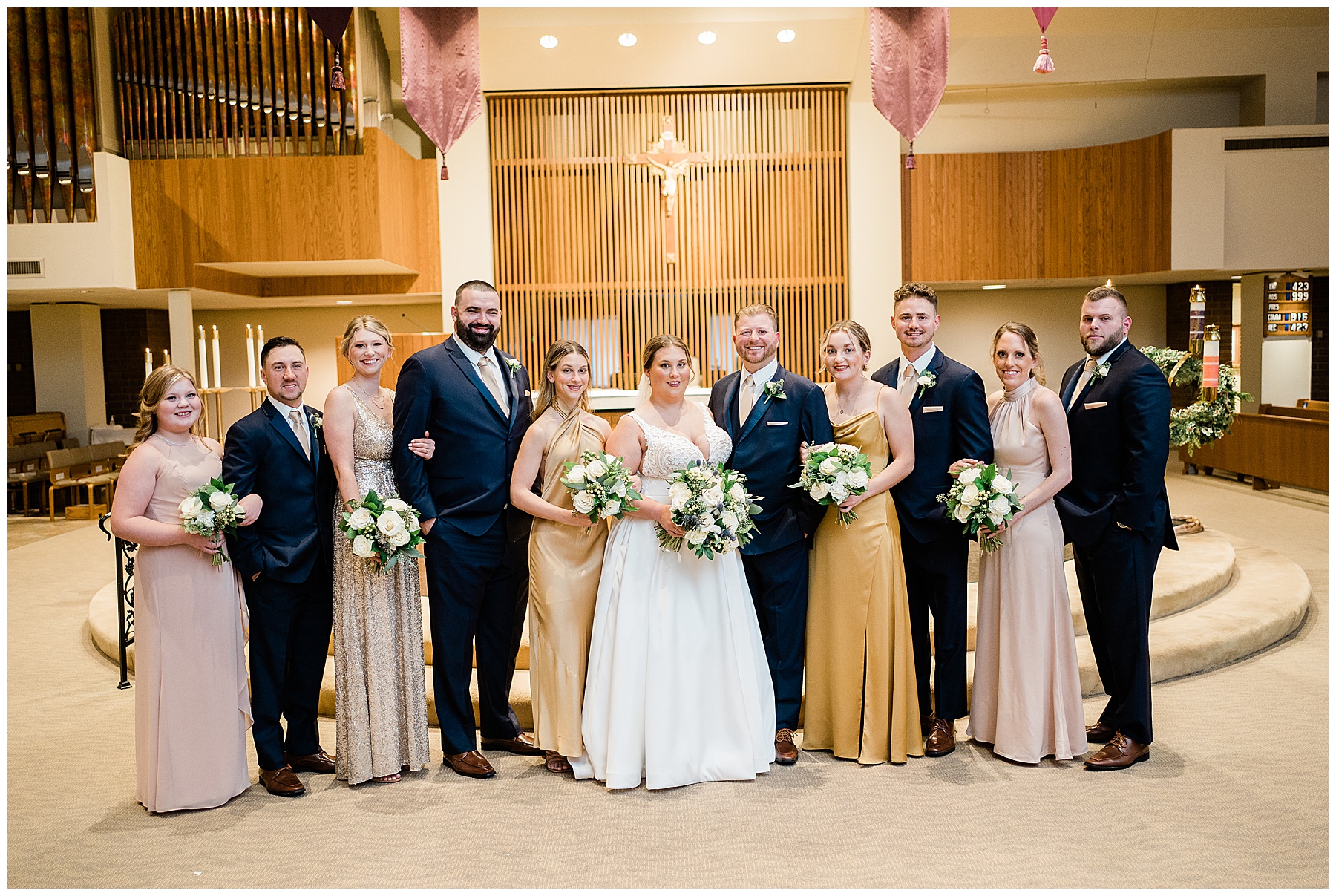 bridal party posing after st charles wedding
