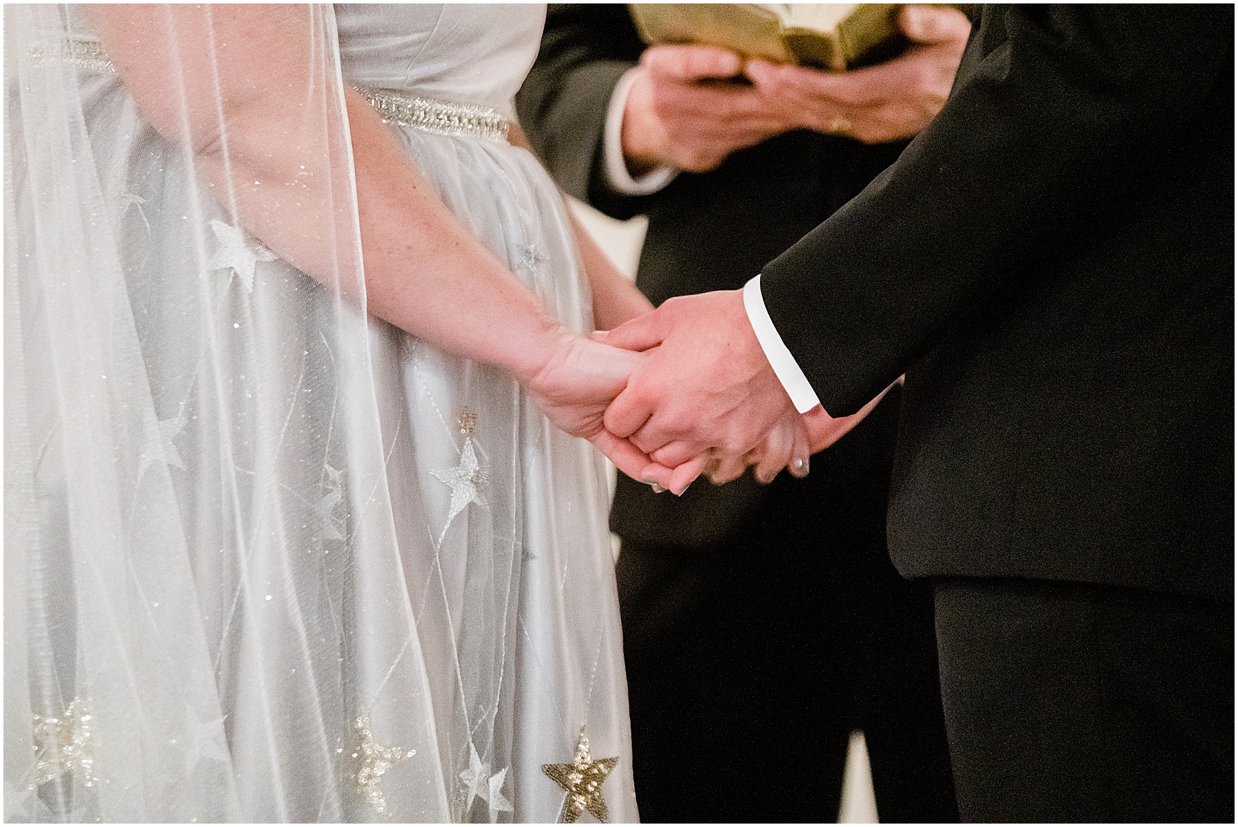 bride and groom holding hands during new year's eve wedding ceremony