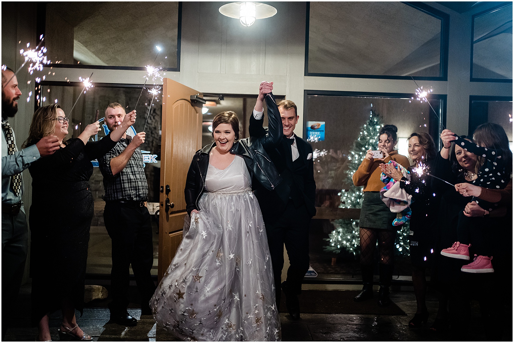 Fort wayne wedding photographers capture bride and groom leaving wedding as husband and wife