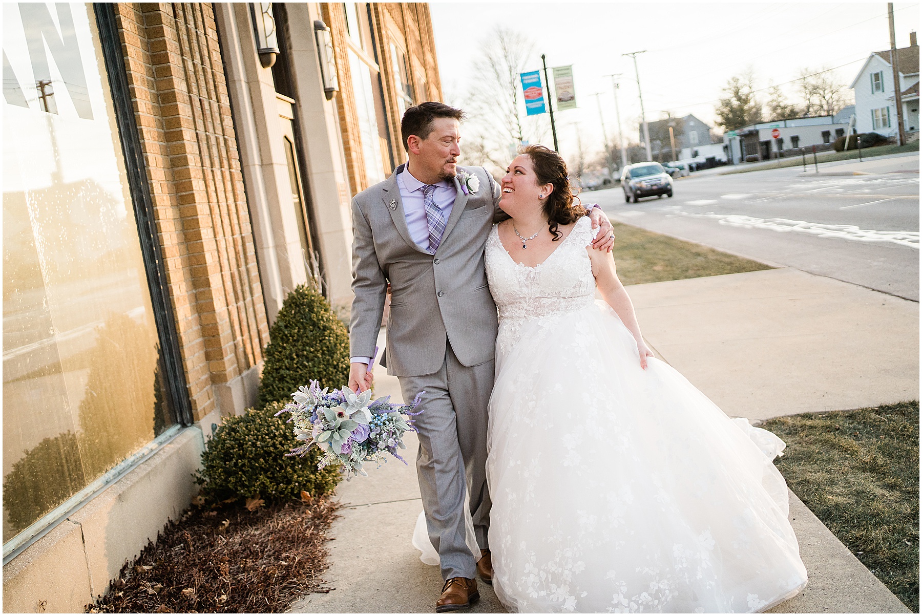 bride and groom walking downtown together