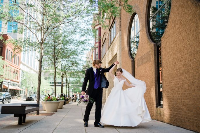 bride and groom in downtown fort wayne taking bridals 