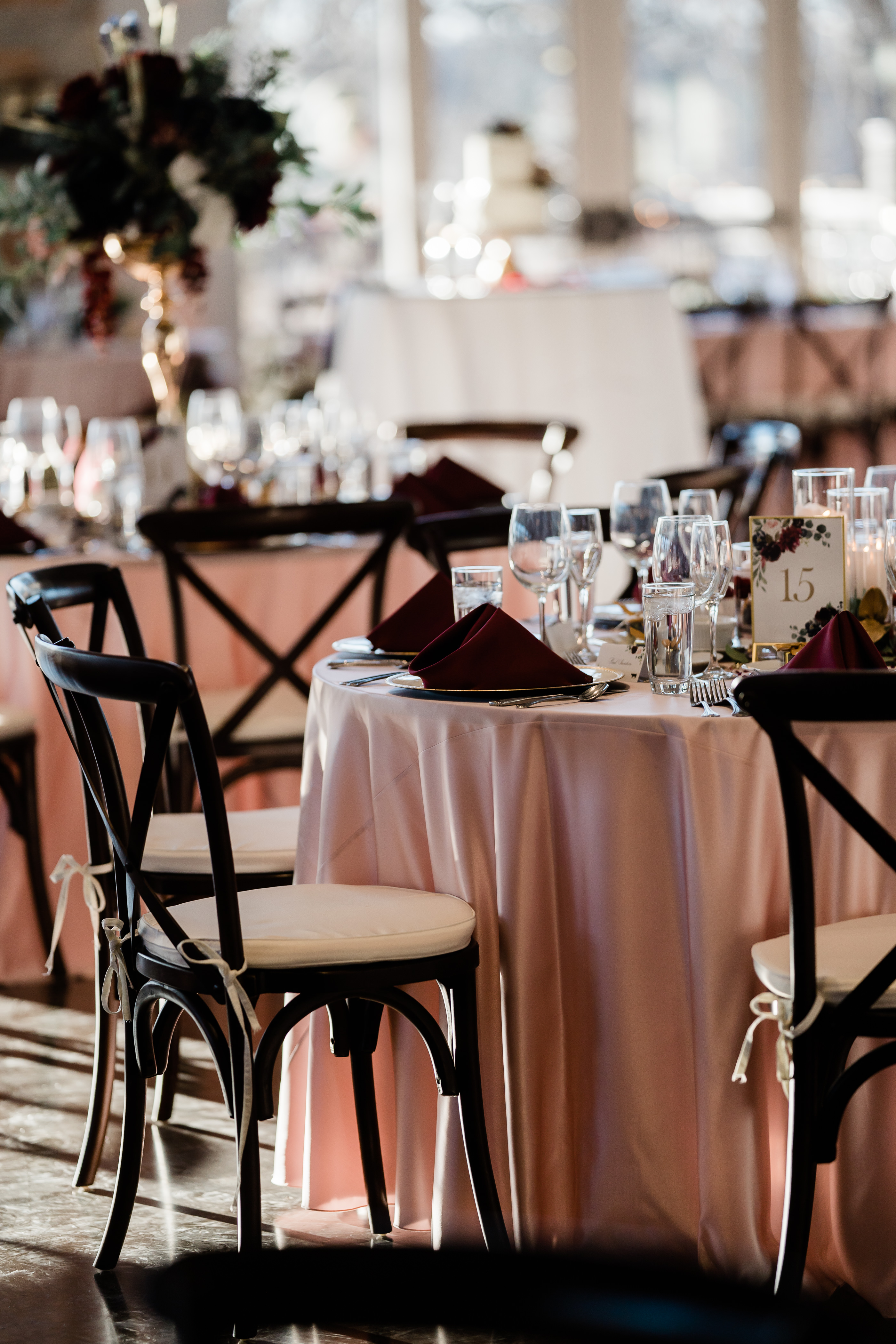 wedding venue set up with pink table clothes and black chairs for an Indianapolis wedding day