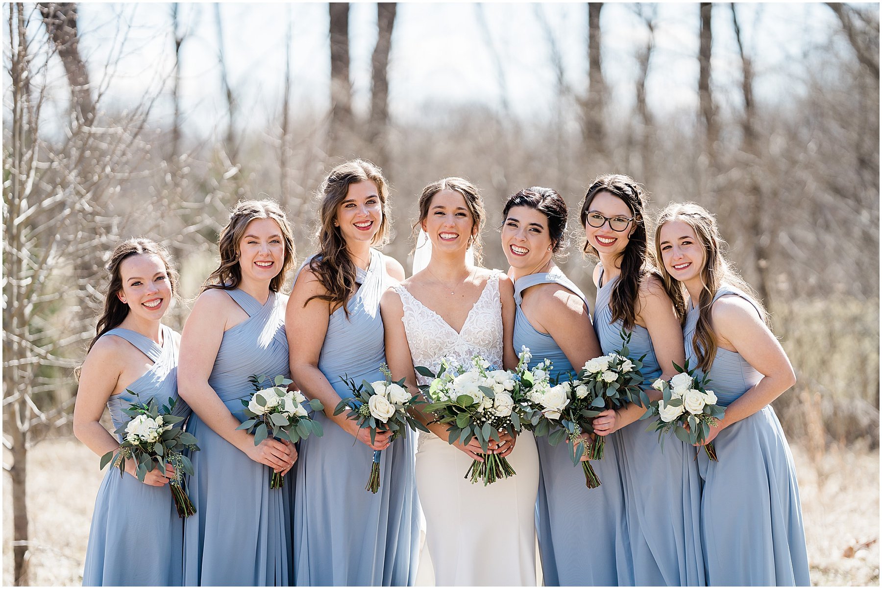 bride and bridesmaids outdoors during portraits
