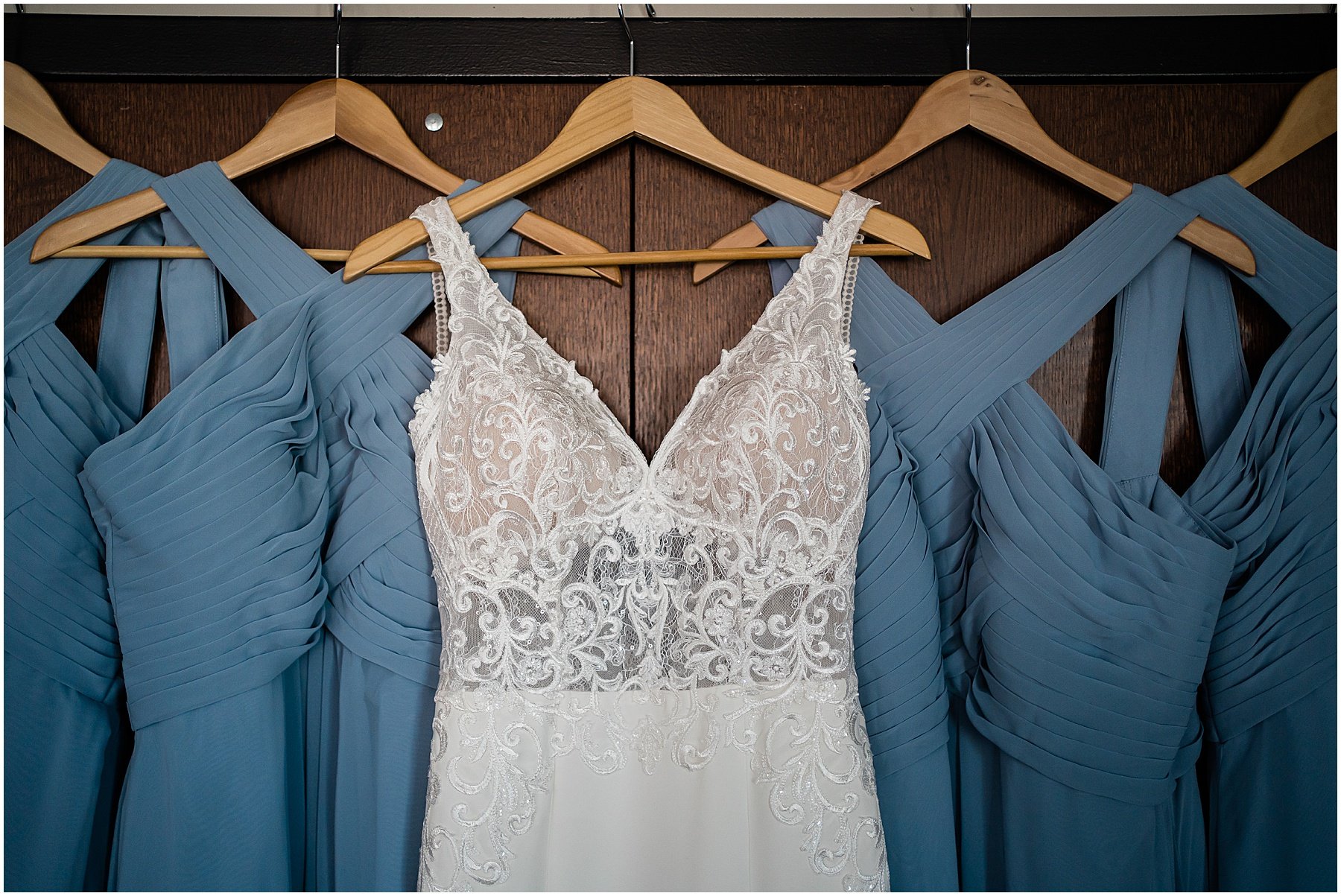 close up shot of bridal gown and bridesmaids dresses 