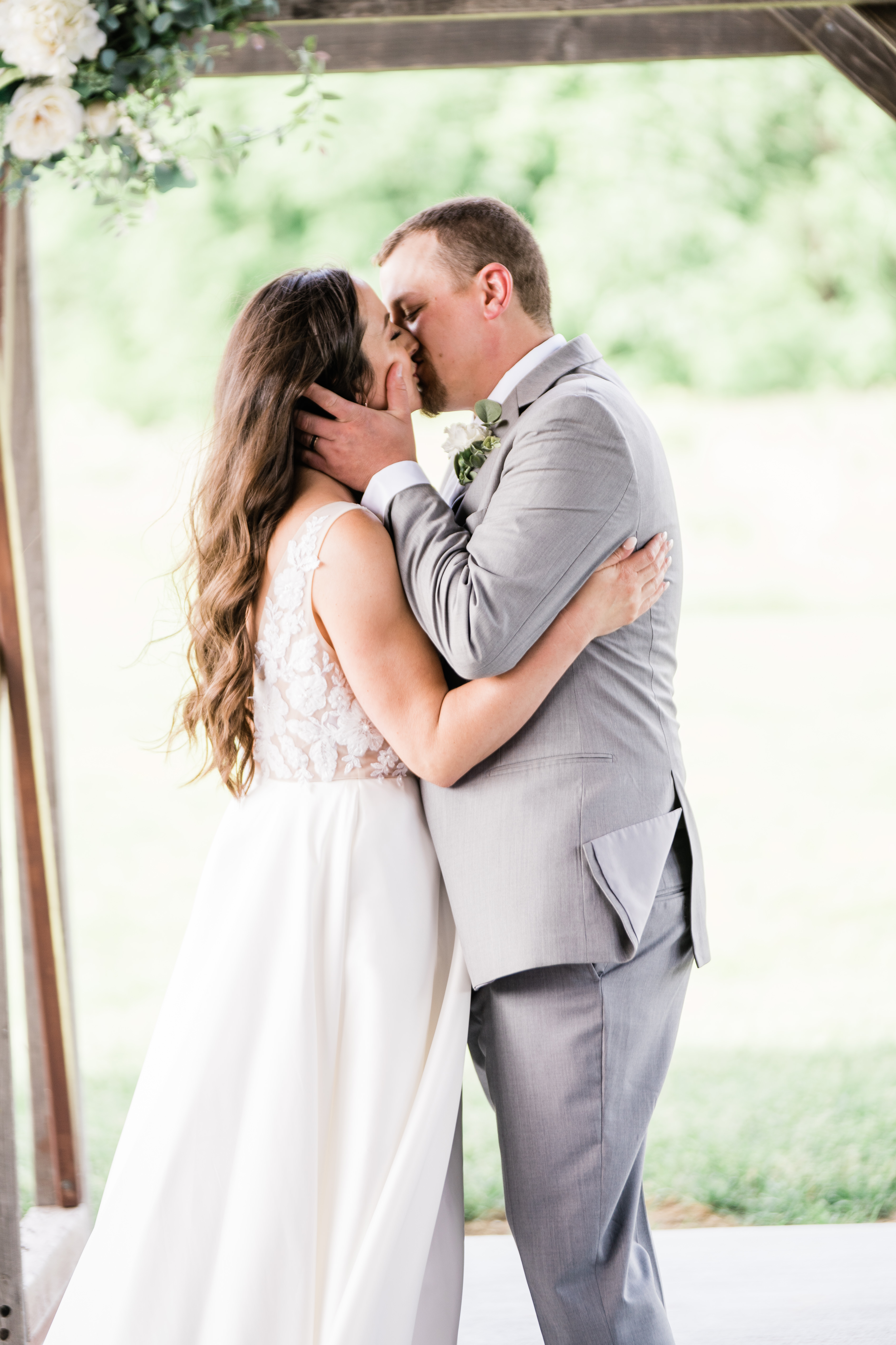 firwst kiss as husband and wife taken by Fort Wayne wedding photographers