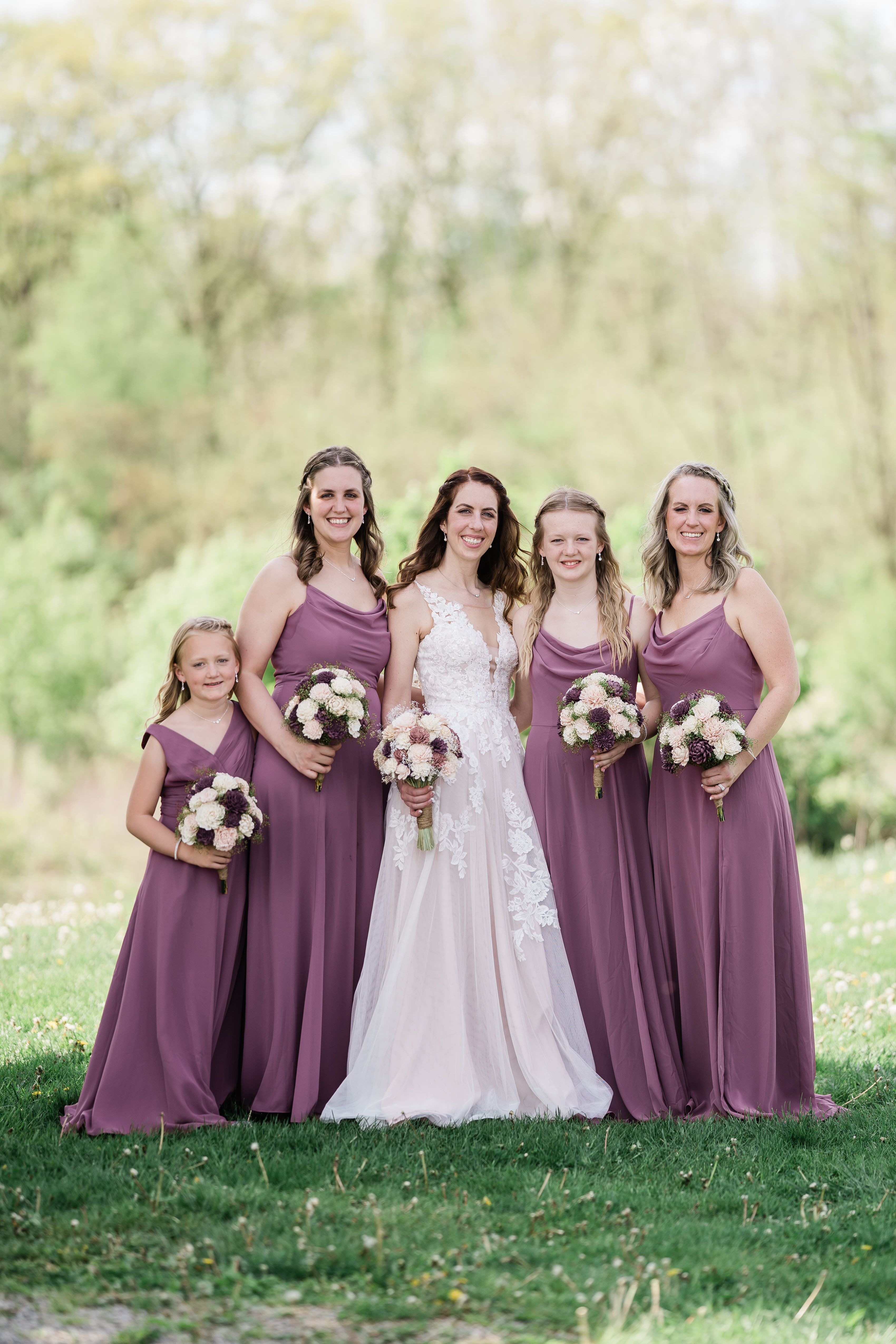 bride and bridesmaids in blush gowns taken by Fort Wayne wedding photographer