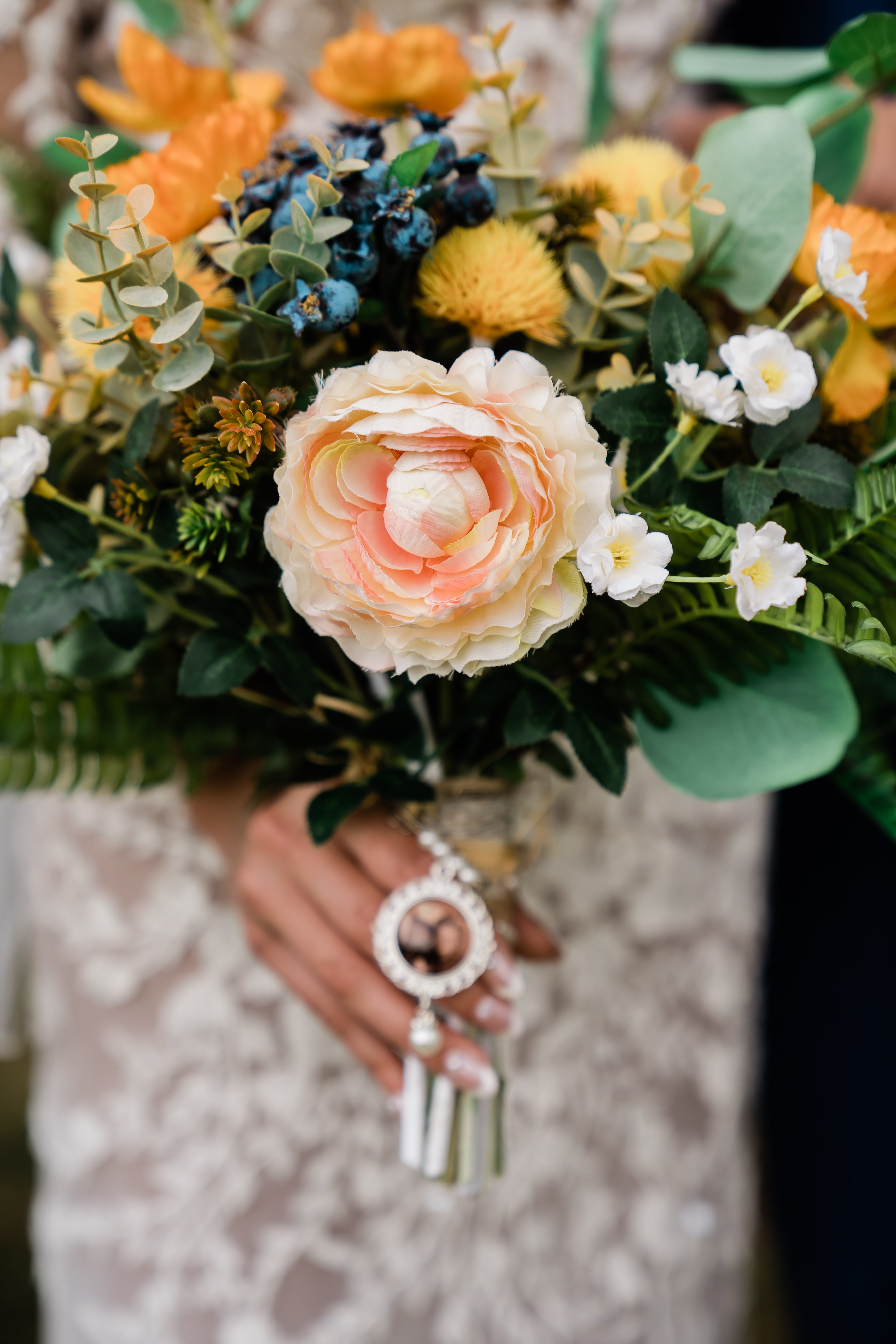 brides bouquet in Fort Wayne wedding with blush pink and coral florals