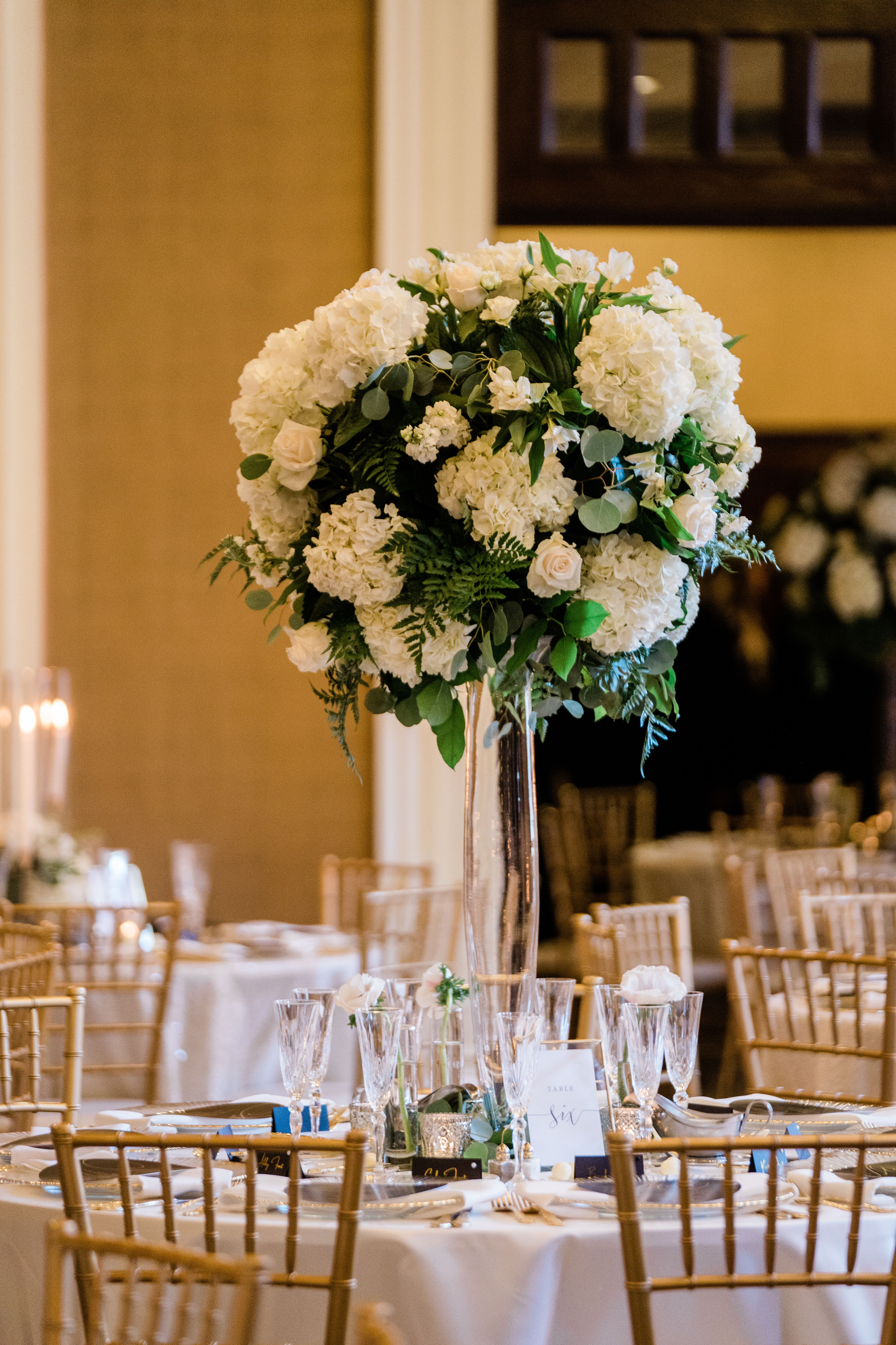 Fort Wayne wedding photographers capture tall floral wedding centerpiece