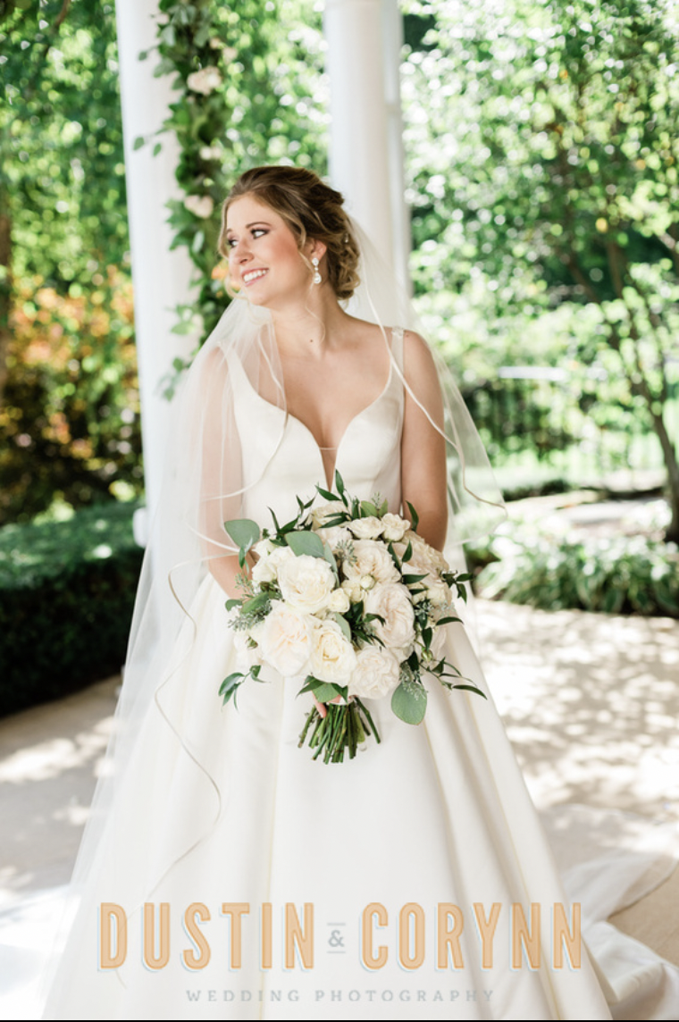 Fort Wayne wedding photographer captures bride wearing wedding gown holding bridal bouquet at Sycamore Hills Golf Club