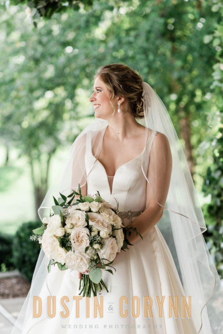 Fort Wayne wedding photographer captures bride holding bridal bouquet during Sycamore Hills Golf Club bridals
