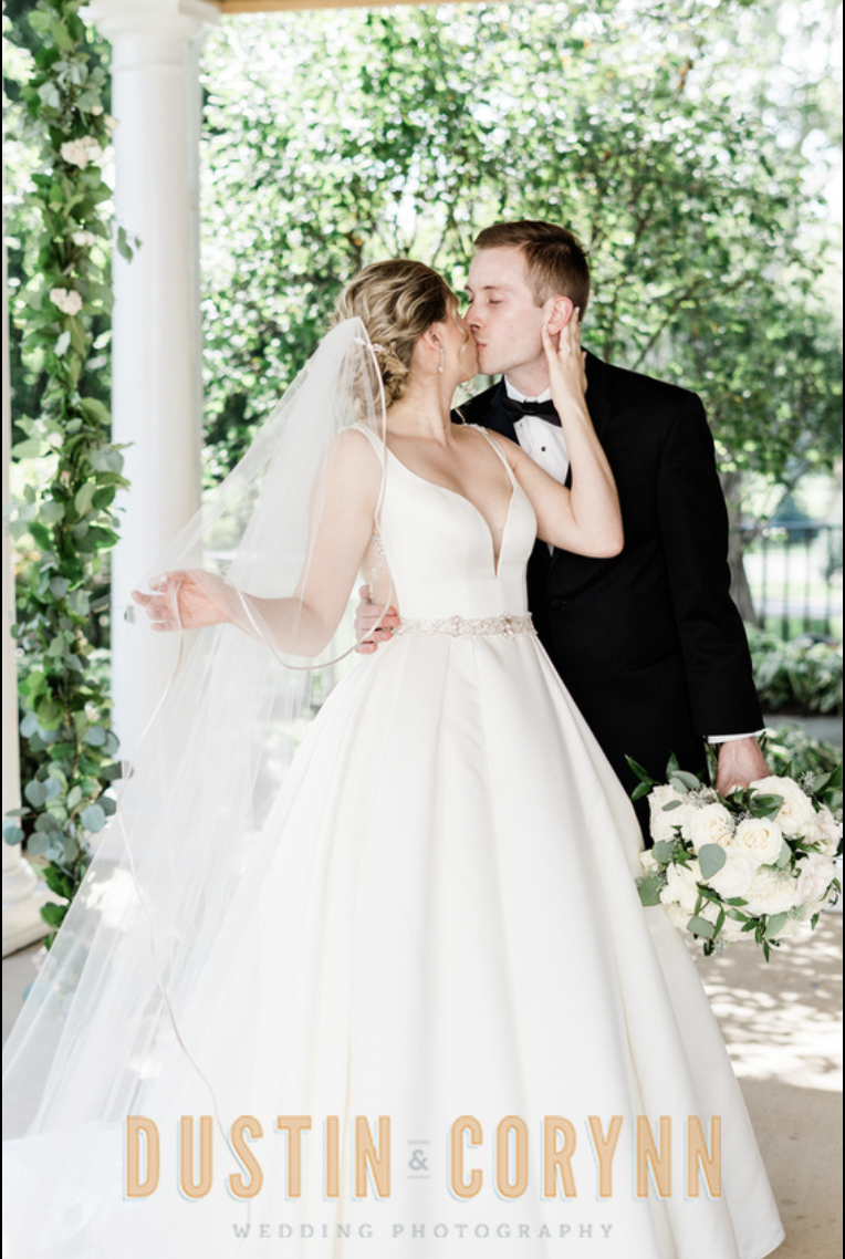 Fort Wayne wedding photographer captures Sycamore Hills Golf Club bridal portraits with bride and groom kissing