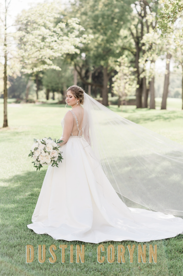 Fort Wayne wedding photographer captures bride holding white bouquet during Sycamore Hills Golf Club bridals