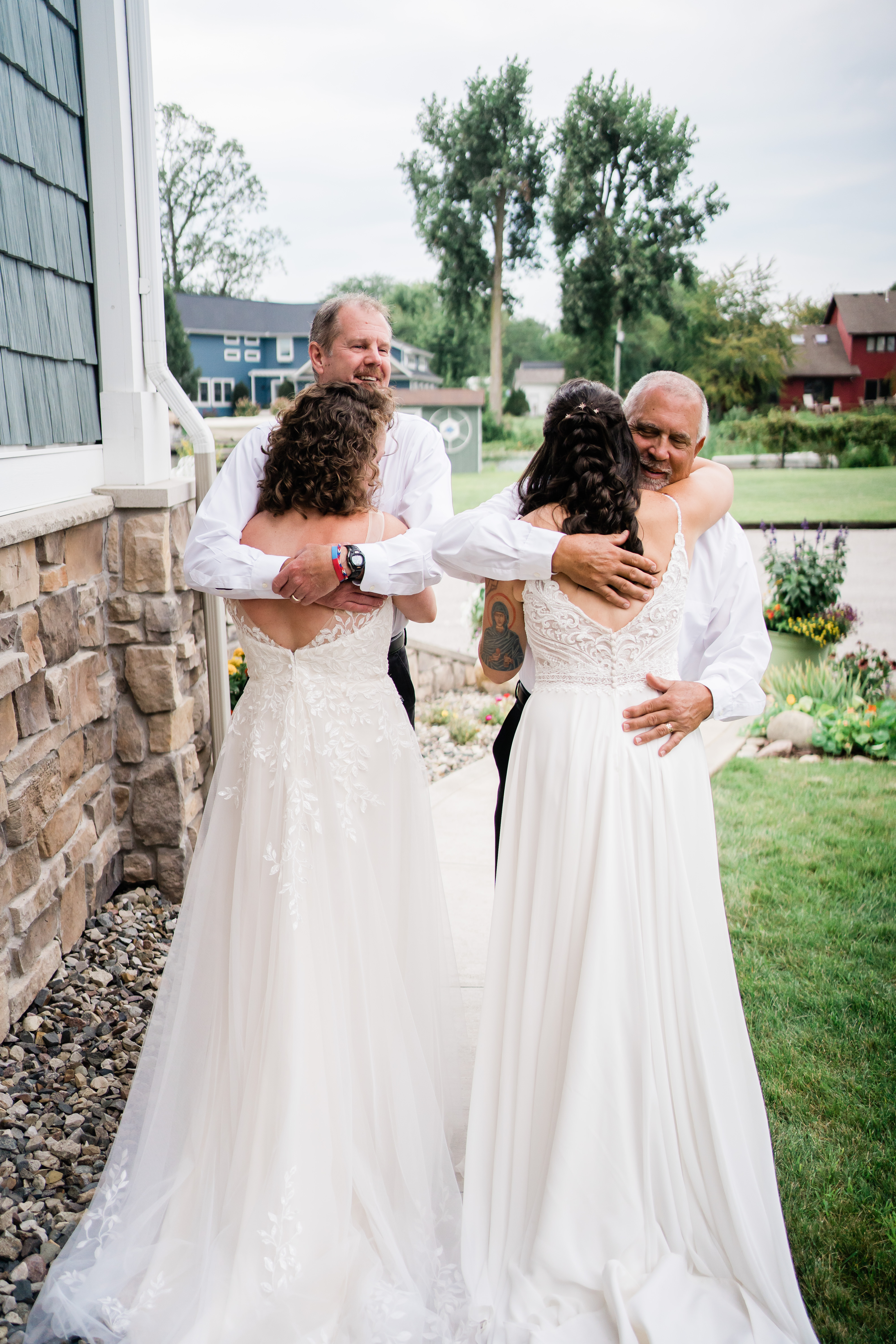 brides hugging fathers