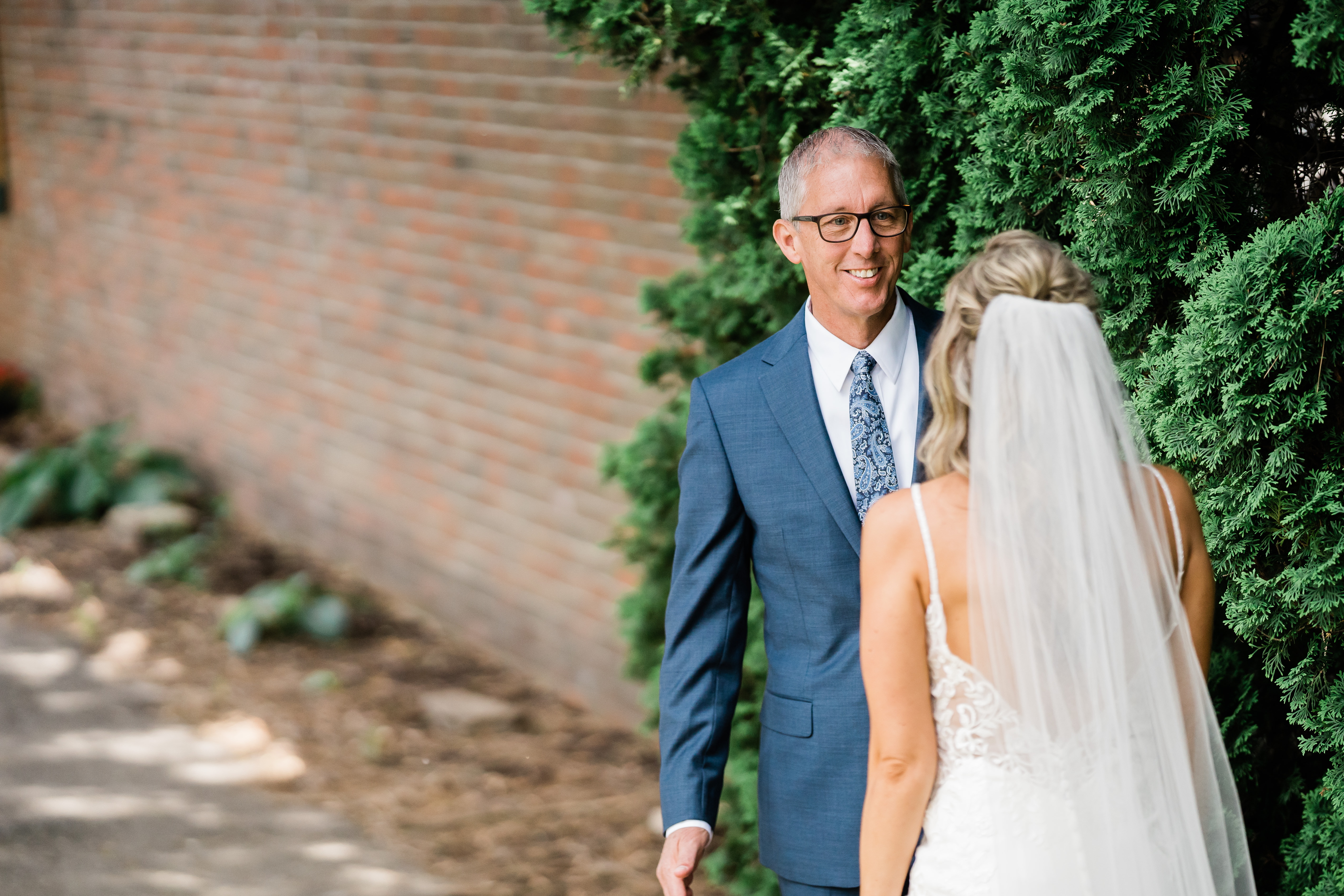 Fort Wayne wedding photographer captures father of bride seeing bride in wedding gown for first time