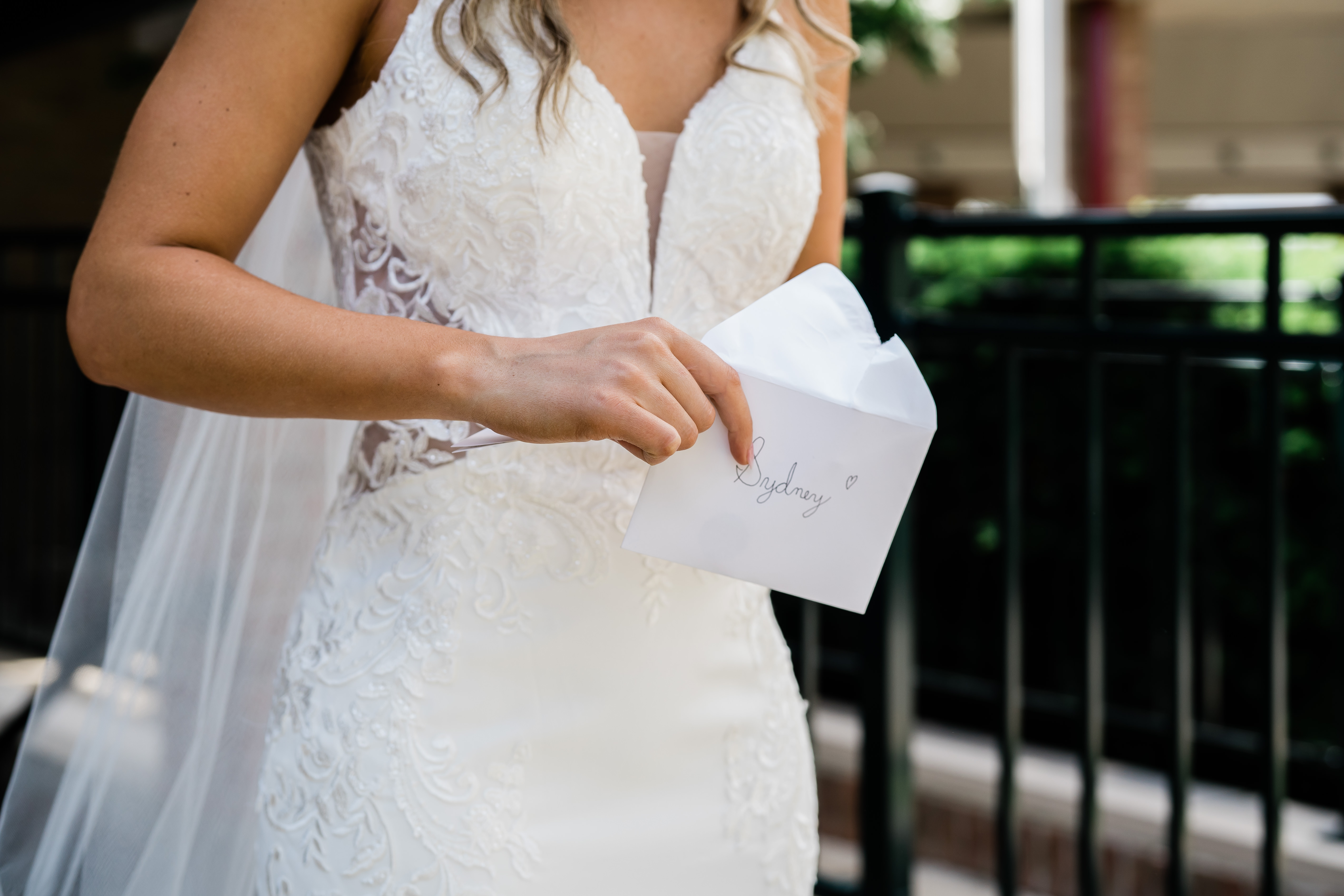 Fort wayne wedding photographers capture bride reading letter from groom