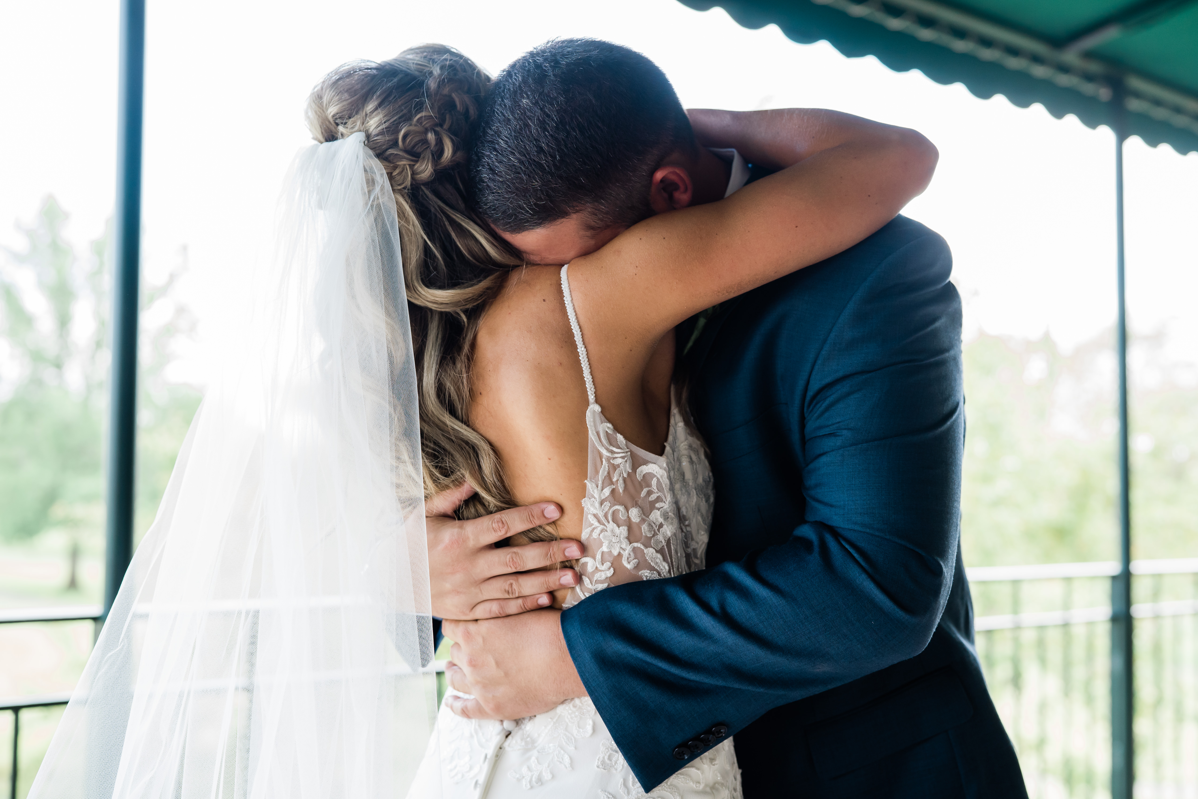 Fort Wayne wedding photographers capture bride and groom hugging