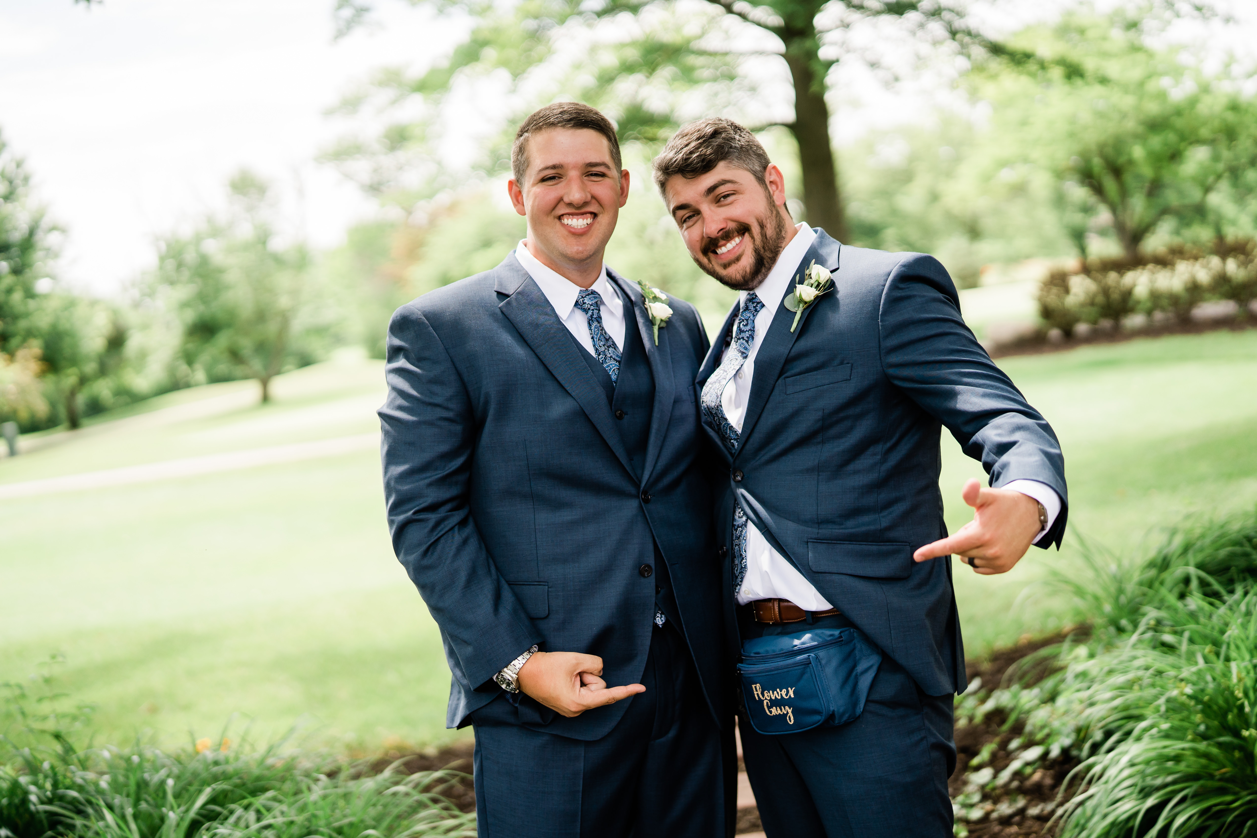 Fort Wayne wedding photographer captures groom standing with flower guy