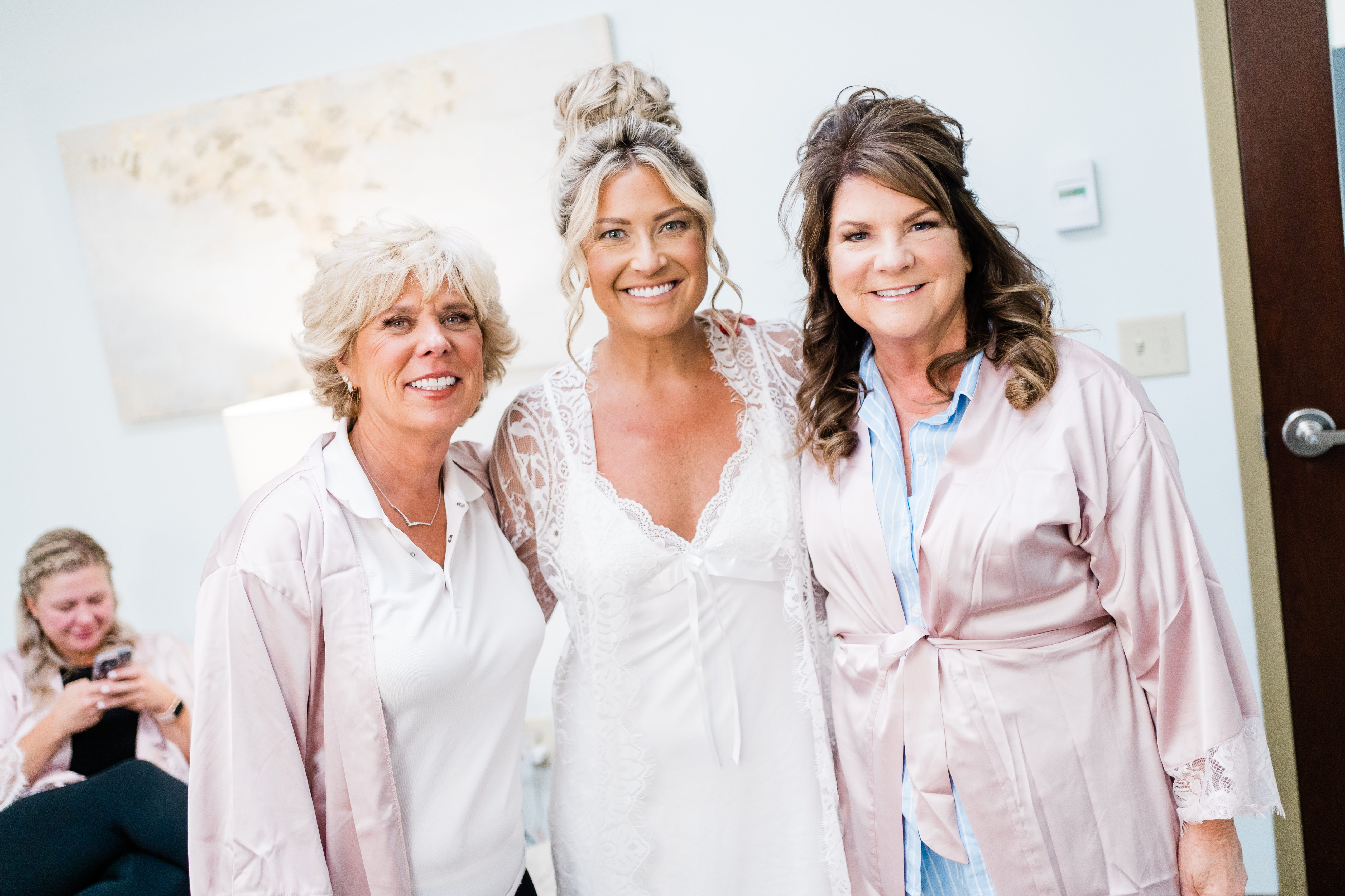 Fort Wayne wedding photographer captures bride standing with her mom and groom's mom before modern ohio golf course wedding
