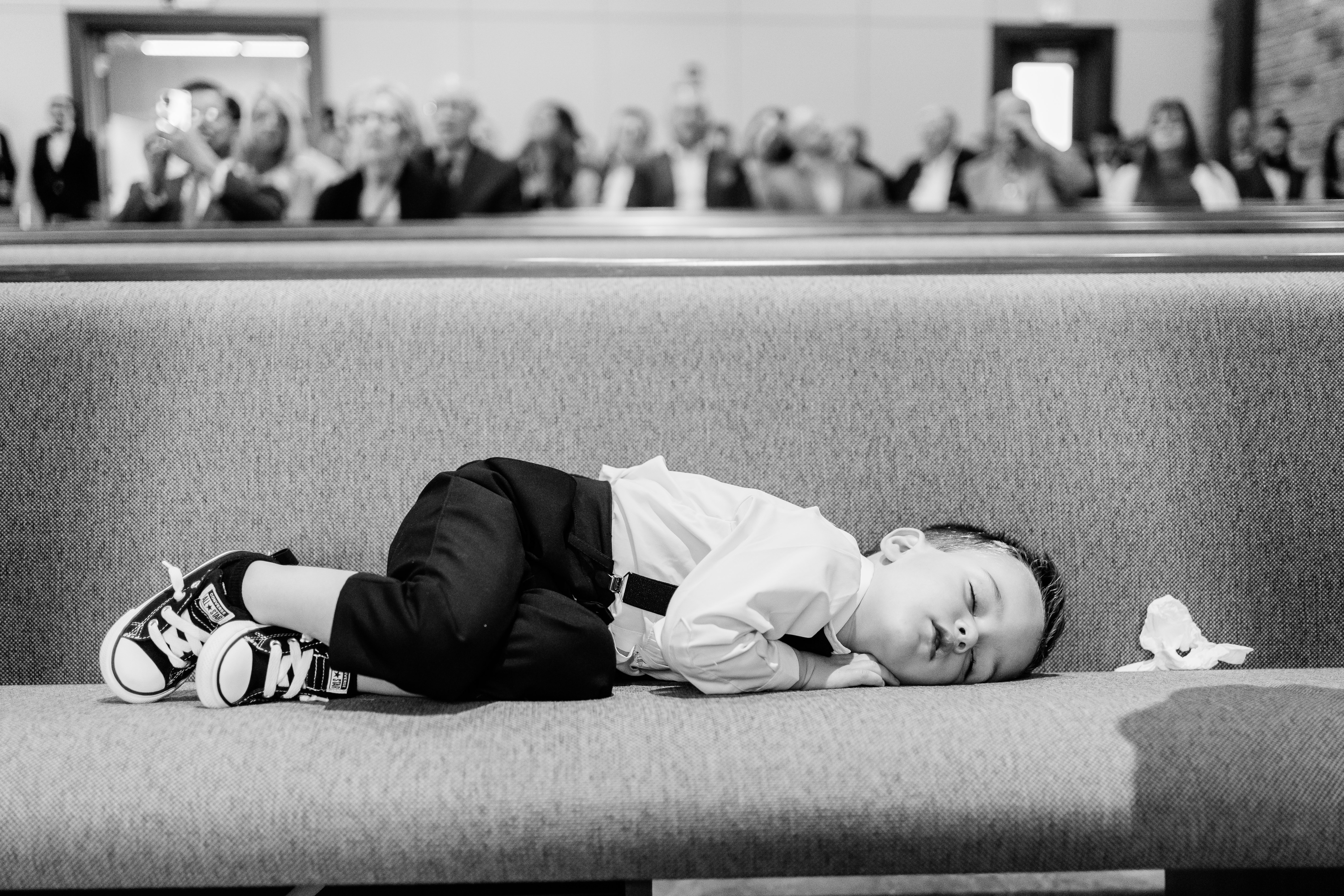 little boy sleeping during wedding ceremony