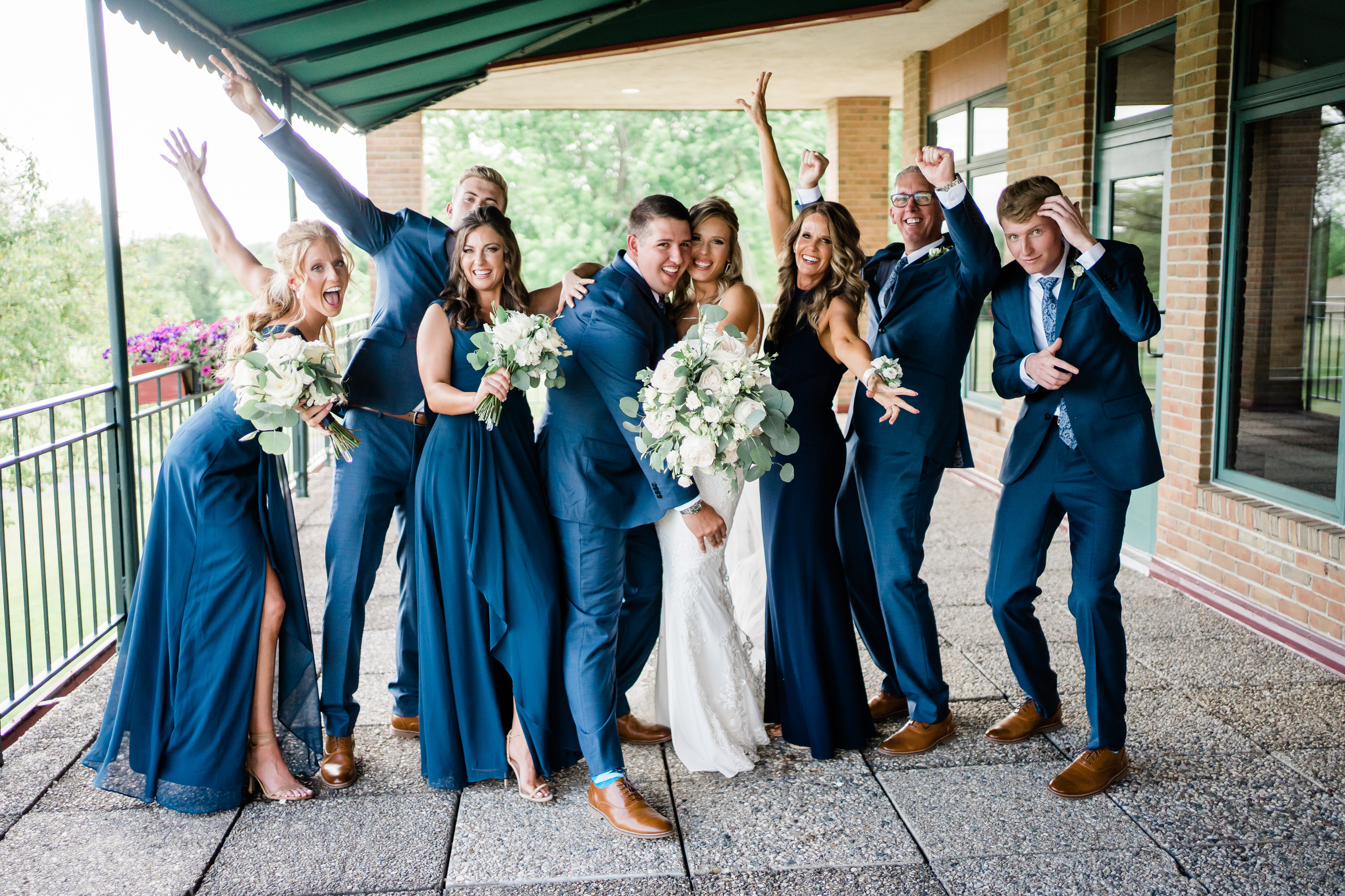 Fort Wayne wedding photographers capture bridal party celebrating bride and groom