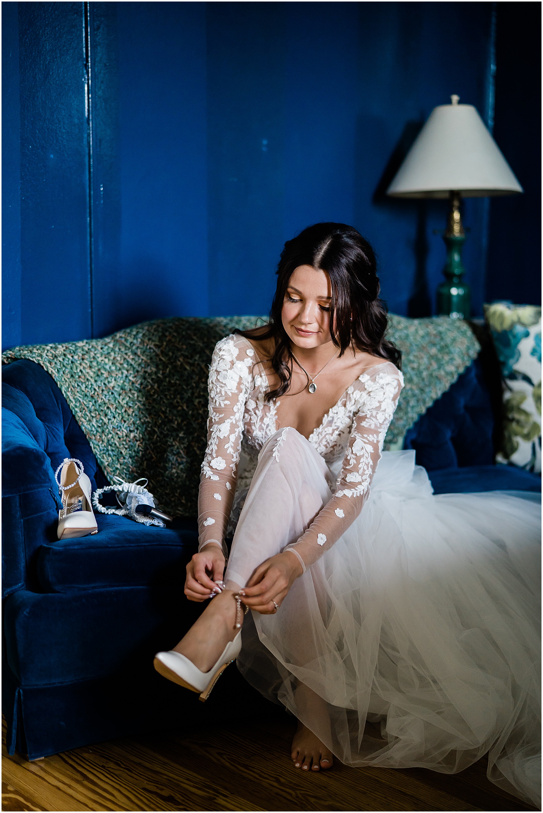 Fort Wayne wedding photographers capture bride putting on shoes before walking down aisle