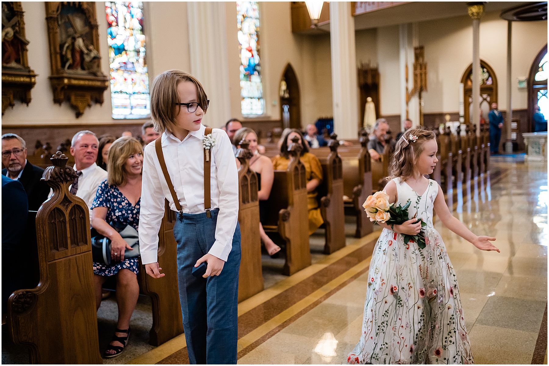 Fort Wayne wedding photographer captures ring bearer and flower girl walking down aisle