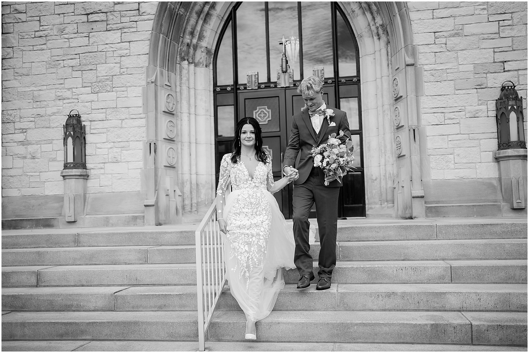 Fort Wayne wedding photographer capture bride and groom holding hands while walking down stairs 