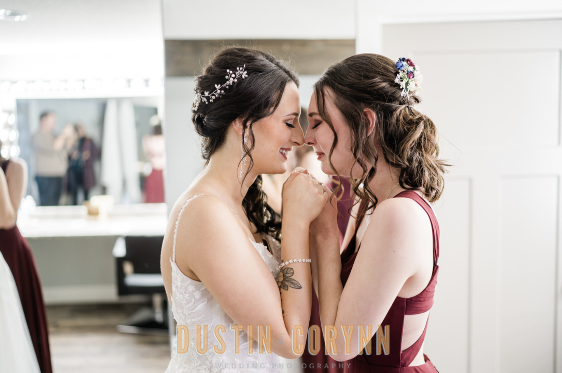 Fort Wayne wedding photographer captures bride embracing bridesmaid