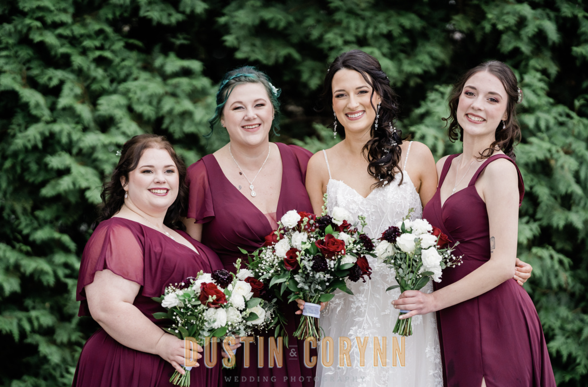 Fort Wayne wedding photographer captures bride with bridesmaids holding bridal bouquets