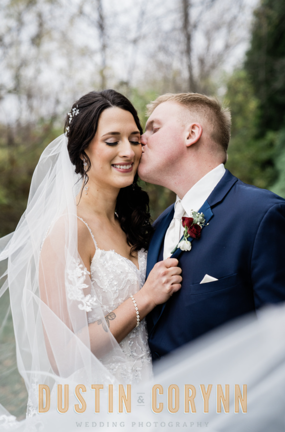 Fort Wayne wedding photographer captures groom kissing bride's cheek